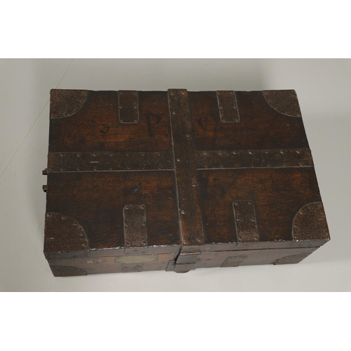 1602 - MILITARY INTEREST: AN OAK AND IRON BOUND CANTEEN CHEST. with iron strapwork and iron handles to each... 