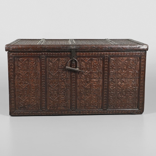 1604 - A LARGE 19TH CENTURY CARVED ISLAMIC COFFER. panelled and carved on all sides with symbols and motifs... 