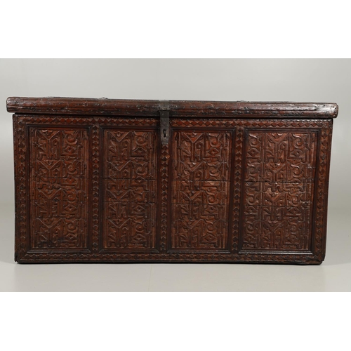 1604 - A LARGE 19TH CENTURY CARVED ISLAMIC COFFER. panelled and carved on all sides with symbols and motifs... 