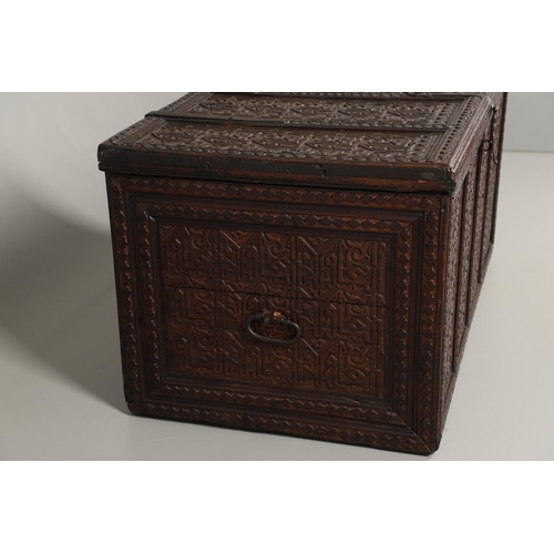 1604 - A LARGE 19TH CENTURY CARVED ISLAMIC COFFER. panelled and carved on all sides with symbols and motifs... 