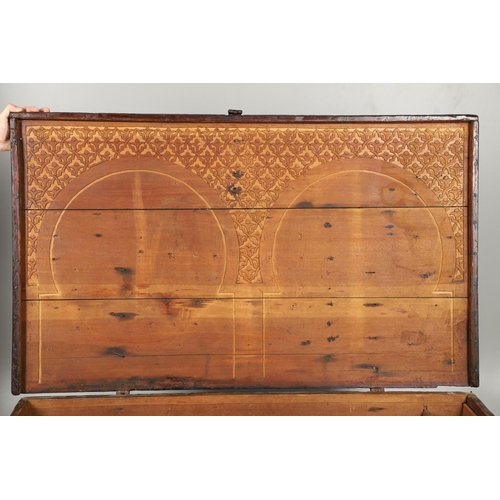 1604 - A LARGE 19TH CENTURY CARVED ISLAMIC COFFER. panelled and carved on all sides with symbols and motifs... 