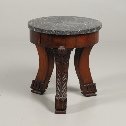 1607 - AN EMPIRE ROSEWOOD LOW TABLE. with a circular dark grey marble top upon a triform base, heavily carv... 