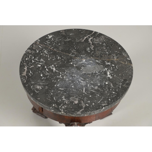 1607 - AN EMPIRE ROSEWOOD LOW TABLE. with a circular dark grey marble top upon a triform base, heavily carv... 