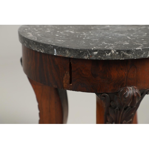 1607 - AN EMPIRE ROSEWOOD LOW TABLE. with a circular dark grey marble top upon a triform base, heavily carv... 