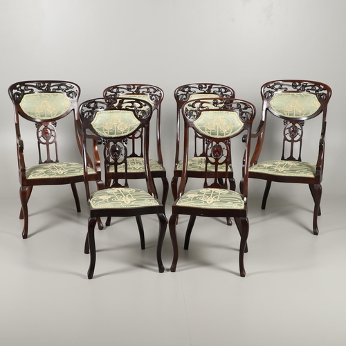 1609 - A SET OF SIX ART NOUVEAU MAHOGANY DINING CHAIRS. circa 1900, the backs pierced and carved with fruit... 