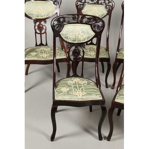 1609 - A SET OF SIX ART NOUVEAU MAHOGANY DINING CHAIRS. circa 1900, the backs pierced and carved with fruit... 