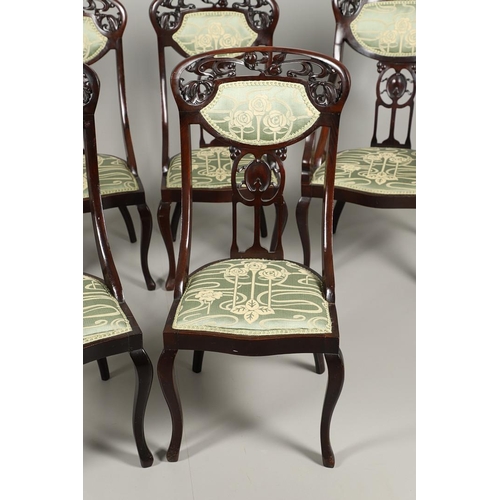 1609 - A SET OF SIX ART NOUVEAU MAHOGANY DINING CHAIRS. circa 1900, the backs pierced and carved with fruit... 