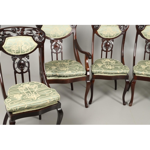 1609 - A SET OF SIX ART NOUVEAU MAHOGANY DINING CHAIRS. circa 1900, the backs pierced and carved with fruit... 