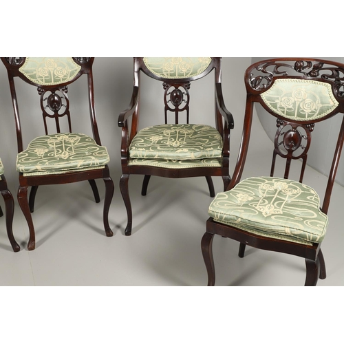 1609 - A SET OF SIX ART NOUVEAU MAHOGANY DINING CHAIRS. circa 1900, the backs pierced and carved with fruit... 