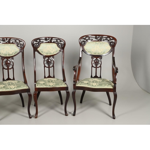 1609 - A SET OF SIX ART NOUVEAU MAHOGANY DINING CHAIRS. circa 1900, the backs pierced and carved with fruit... 