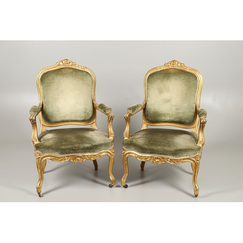 1610 - A PAIR OF 19TH CENTURY LOUIS XV STYLE GILTWOOD FAUTEUILS A LA REINES. each with a carved show frame ... 