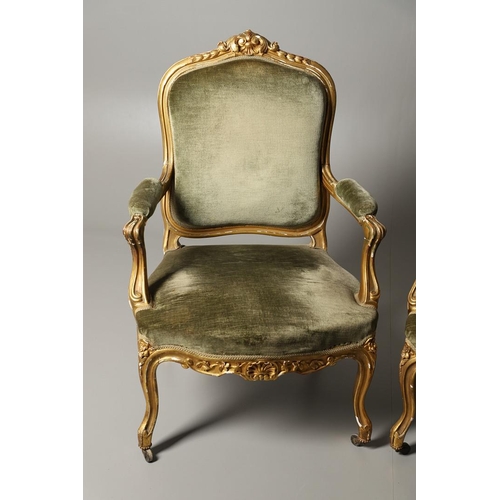 1610 - A PAIR OF 19TH CENTURY LOUIS XV STYLE GILTWOOD FAUTEUILS A LA REINES. each with a carved show frame ... 