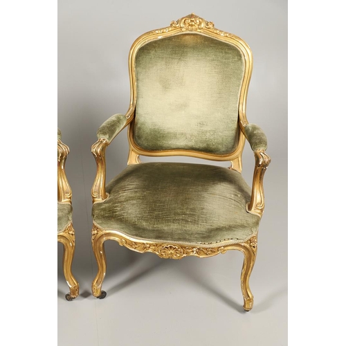 1610 - A PAIR OF 19TH CENTURY LOUIS XV STYLE GILTWOOD FAUTEUILS A LA REINES. each with a carved show frame ... 