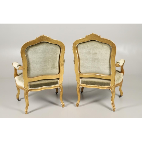 1610 - A PAIR OF 19TH CENTURY LOUIS XV STYLE GILTWOOD FAUTEUILS A LA REINES. each with a carved show frame ... 