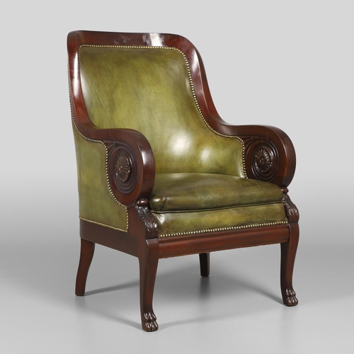 1612 - A 19TH CENTURY GREEN LEATHER MAHOGANY LIBRARY ARMCHAIR. the scrolling arm supports with carved flora... 