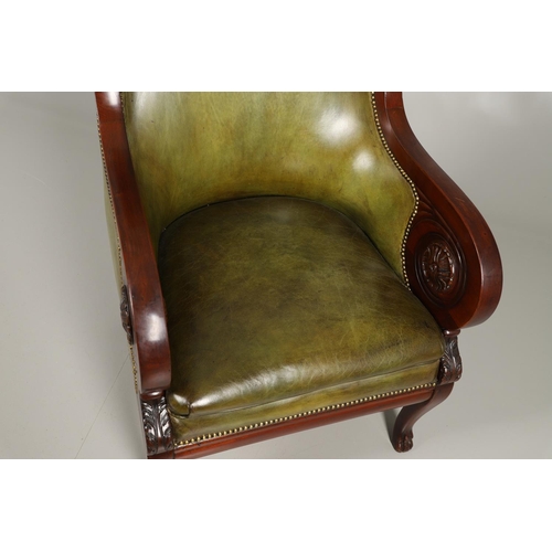 1612 - A 19TH CENTURY GREEN LEATHER MAHOGANY LIBRARY ARMCHAIR. the scrolling arm supports with carved flora... 