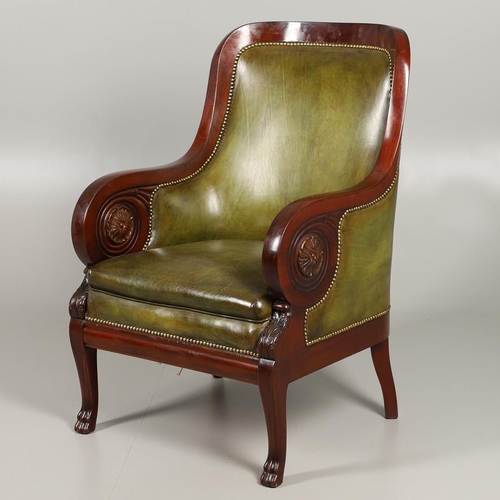 1612 - A 19TH CENTURY GREEN LEATHER MAHOGANY LIBRARY ARMCHAIR. the scrolling arm supports with carved flora... 