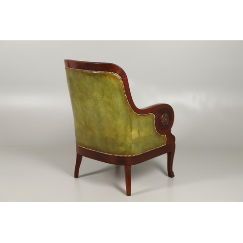 1612 - A 19TH CENTURY GREEN LEATHER MAHOGANY LIBRARY ARMCHAIR. the scrolling arm supports with carved flora... 