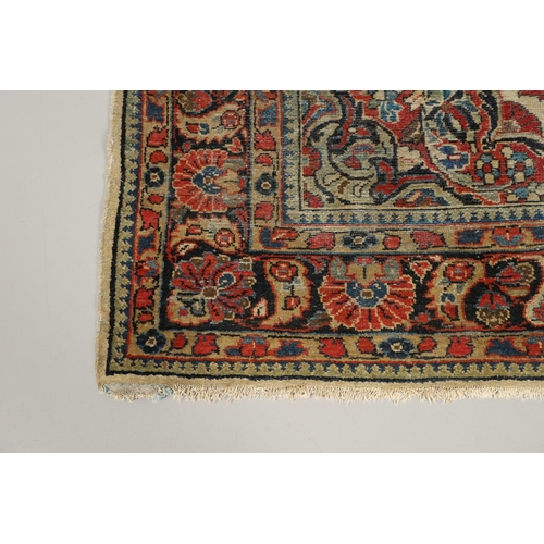 1731 - A WEST PERSIAN SINGLE WEFTED RUG, CIRCA 1940. the ivory field of vines around a central floral panel... 