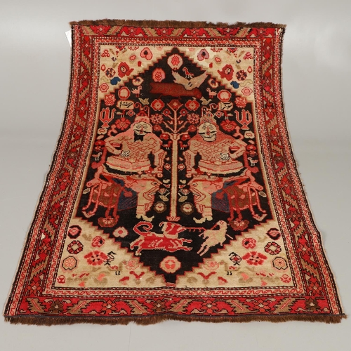 1733 - A KARABAGH RUG, SOUTH CAUCASUS, CIRCA 1920. the field depicting two mythological figures surrounded ... 