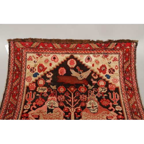 1733 - A KARABAGH RUG, SOUTH CAUCASUS, CIRCA 1920. the field depicting two mythological figures surrounded ... 