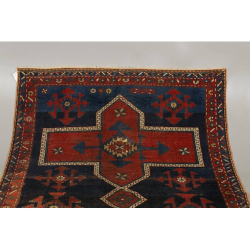 1734 - A KAZAK RUG, CENTRAL CAUCASUS, CIRCA 1910. the indigo field with two terracotta cruciform medallions... 