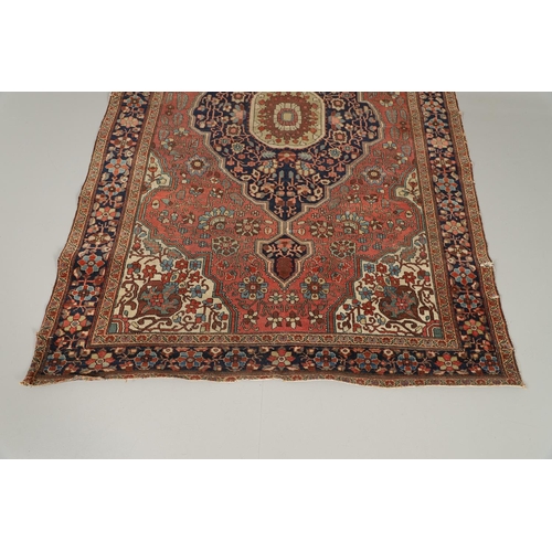 1735 - A SAROUK RUG, WEST PERSIA, CIRCA 1930. the brick red field of angular vines around an ivory and indi... 