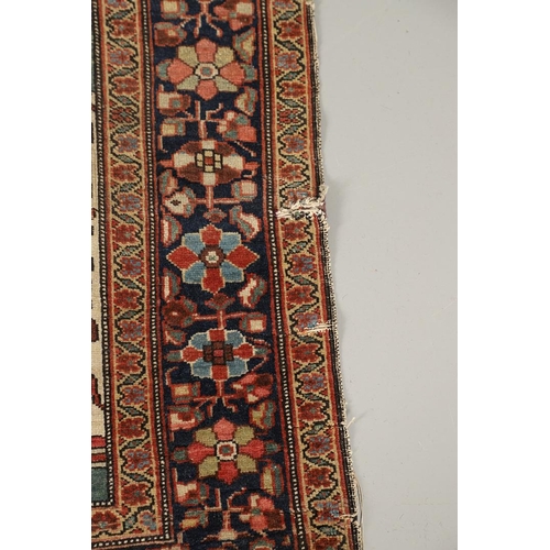 1735 - A SAROUK RUG, WEST PERSIA, CIRCA 1930. the brick red field of angular vines around an ivory and indi... 