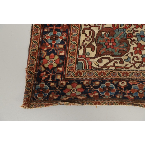 1735 - A SAROUK RUG, WEST PERSIA, CIRCA 1930. the brick red field of angular vines around an ivory and indi... 