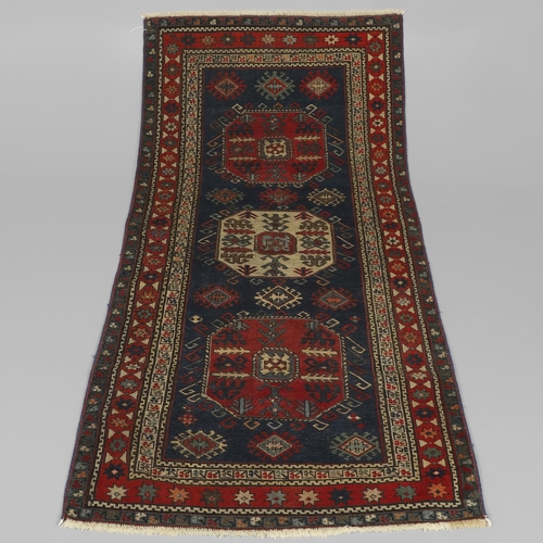 1737 - A CHAJLI RUG, EAST CAUCASUS, CIRCA 1900. the deep indigo field with three large octagons containing ... 