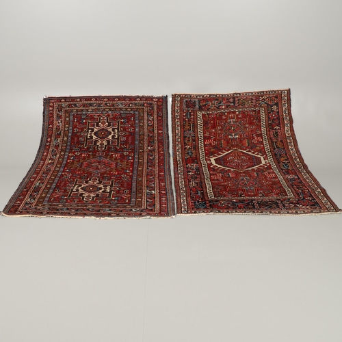 1738 - A KARAJA RUG, NORTH WEST PERSIA, CIRCA 1950. the claret field with three medallions enclosed by mult... 