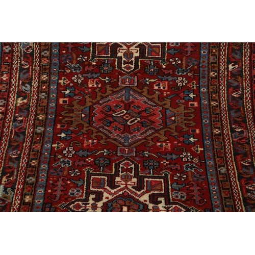 1738 - A KARAJA RUG, NORTH WEST PERSIA, CIRCA 1950. the claret field with three medallions enclosed by mult... 