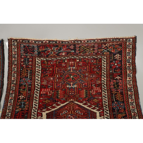 1738 - A KARAJA RUG, NORTH WEST PERSIA, CIRCA 1950. the claret field with three medallions enclosed by mult... 