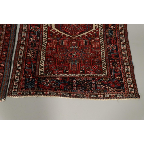 1738 - A KARAJA RUG, NORTH WEST PERSIA, CIRCA 1950. the claret field with three medallions enclosed by mult... 