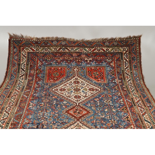 1741 - A KASHGAI RUG, SOUTH WEST PERSIA, CIRCA 1940. the indigo field with three diamond medallions framed ... 