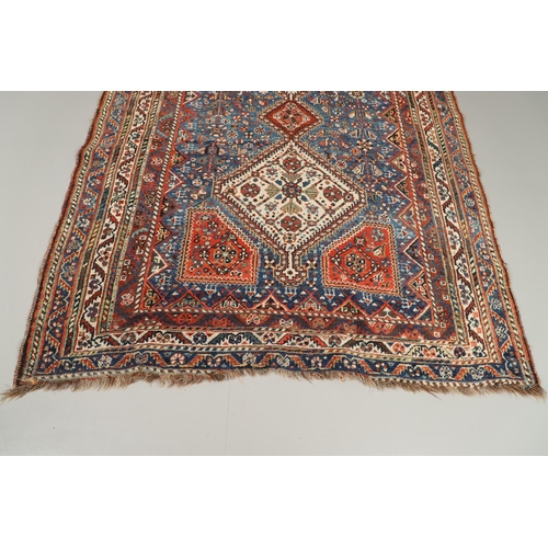 1741 - A KASHGAI RUG, SOUTH WEST PERSIA, CIRCA 1940. the indigo field with three diamond medallions framed ... 