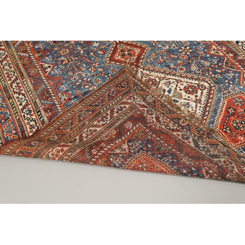 1741 - A KASHGAI RUG, SOUTH WEST PERSIA, CIRCA 1940. the indigo field with three diamond medallions framed ... 