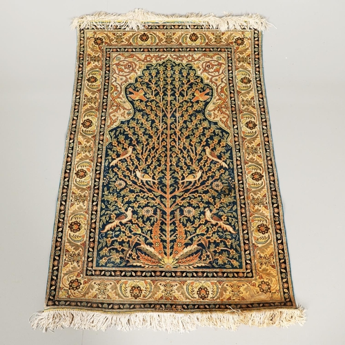 1744 - A MODERN SILK KAYSERI SILK PRAYER RUG. the indigo field with Tree of Life enclosed by floral borders... 