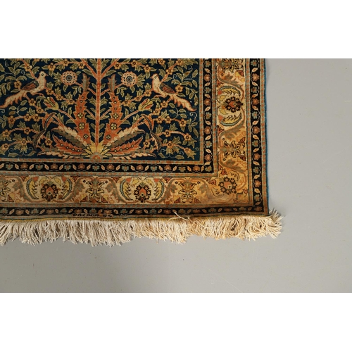 1744 - A MODERN SILK KAYSERI SILK PRAYER RUG. the indigo field with Tree of Life enclosed by floral borders... 