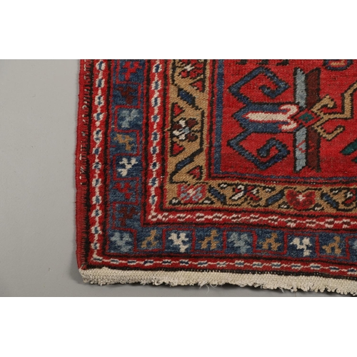 1746 - A HERIZ RUNNER, NORTH WEST PERSIA, 2ND HALF 20TH CENTURY. the brick red field with a column of styli... 