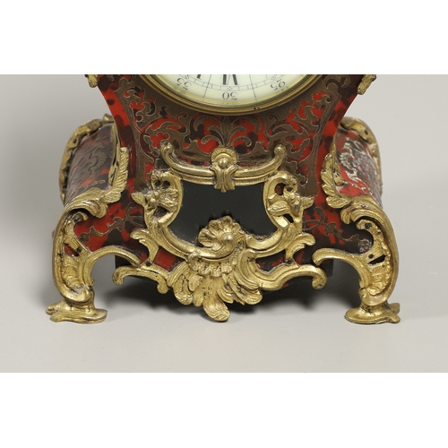 1428 - A 20TH CENTURY FRENCH BOULLE EFFECT CLOCK GARNITURE. the clock with enamel dial above a visible pend... 