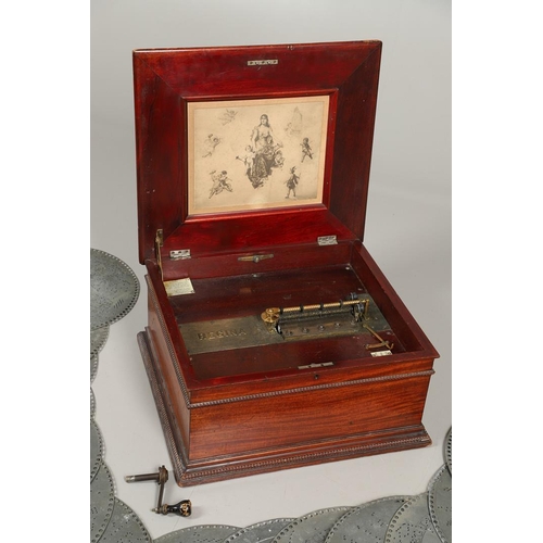 659 - A LATE 19TH CENTURY REGINA POLYPHON DISC PLAYER & 24 DISCS. A large Regina Polython disc player in a... 