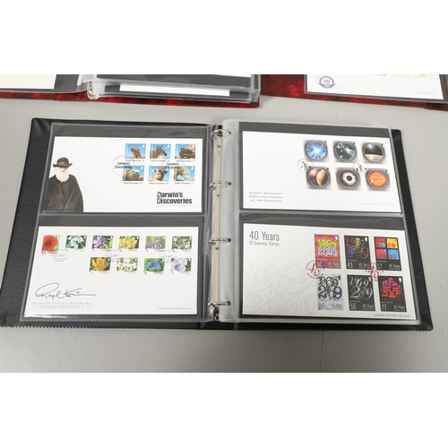 664 - GUERNSEY STAMP ALBUMS & FIRST DAY COVERS. Including two Stanley Gibbons albums with mint  stamps, on... 