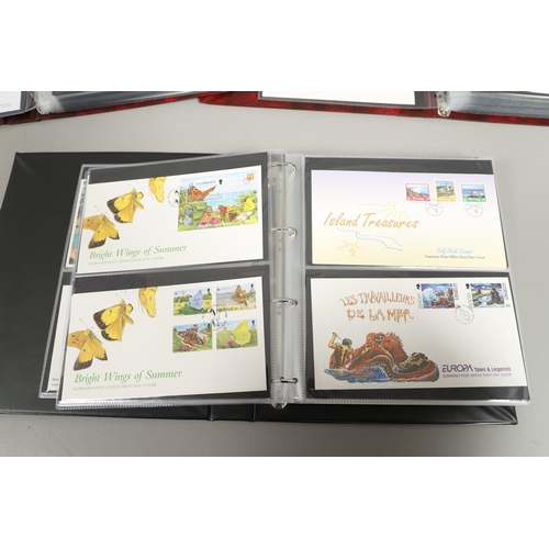 664 - GUERNSEY STAMP ALBUMS & FIRST DAY COVERS. Including two Stanley Gibbons albums with mint  stamps, on... 