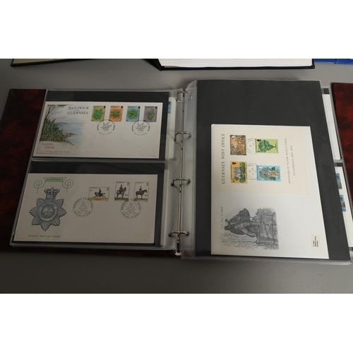 664 - GUERNSEY STAMP ALBUMS & FIRST DAY COVERS. Including two Stanley Gibbons albums with mint  stamps, on... 