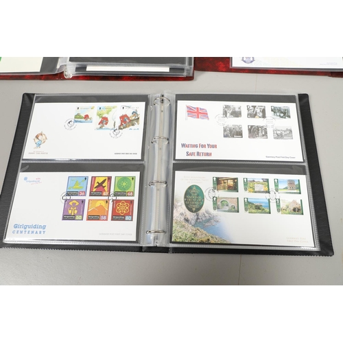 664 - GUERNSEY STAMP ALBUMS & FIRST DAY COVERS. Including two Stanley Gibbons albums with mint  stamps, on... 