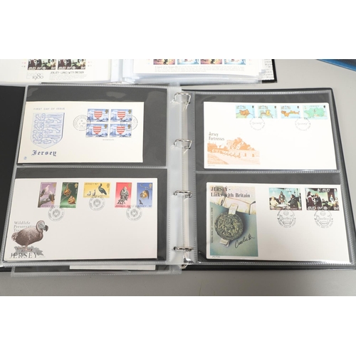 666 - JERSEY STAMP COLLECTION & FIRST DAY COVERS. Including three Stanley Gibbons albums in slip cases (Vo... 