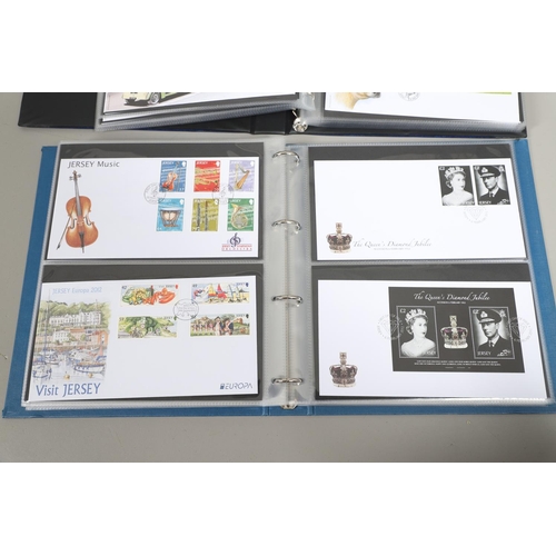 666 - JERSEY STAMP COLLECTION & FIRST DAY COVERS. Including three Stanley Gibbons albums in slip cases (Vo... 