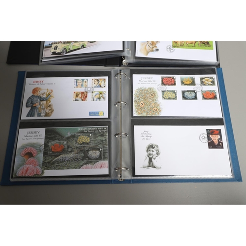 666 - JERSEY STAMP COLLECTION & FIRST DAY COVERS. Including three Stanley Gibbons albums in slip cases (Vo... 