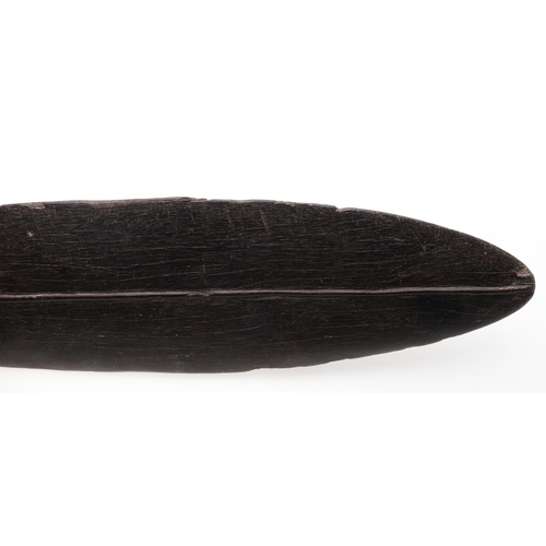 725 - LARGE TRIBAL HARDWOOD PADDLE. Possibly South Sea Islands, a large hardwood tribal paddle with a tape... 